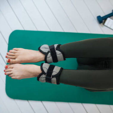 Young female athlete exercising on a yoga mat.